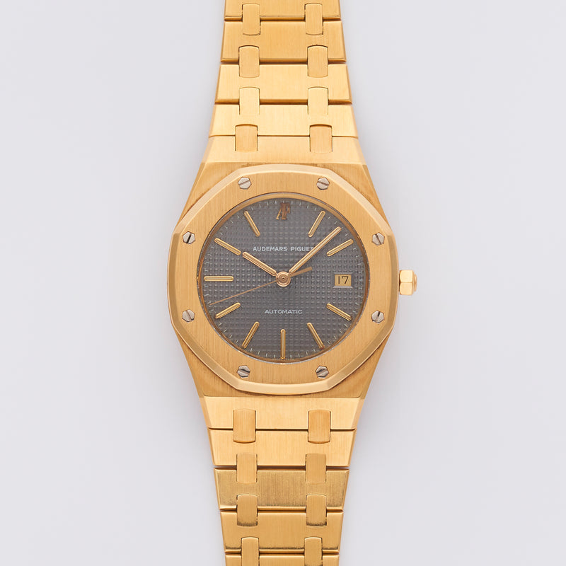 1986 Audemars Piguet Royal Oak 18k Yellow Gold Grey Dial 14486BA with its Certificat d'origine et de garantie, AP and Wempe service papers