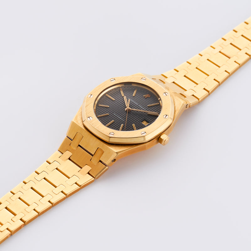1986 Audemars Piguet Royal Oak 18k Yellow Gold Grey Dial 14486BA with its Certificat d'origine et de garantie, AP and Wempe service papers