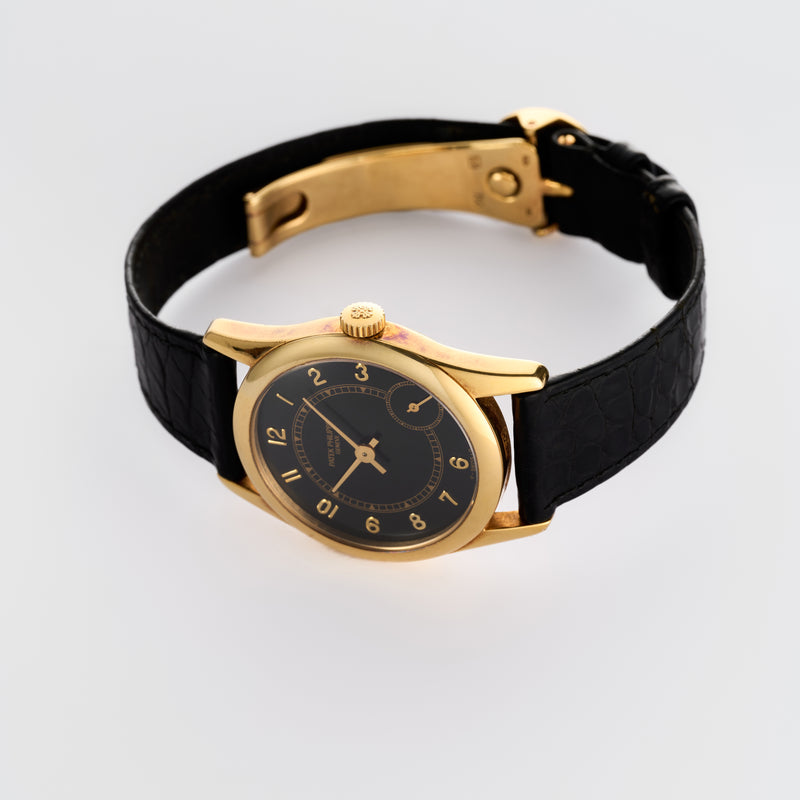 1990s Patek Philippe Calatrava 18k Yellow Gold Black Dial 5000J
