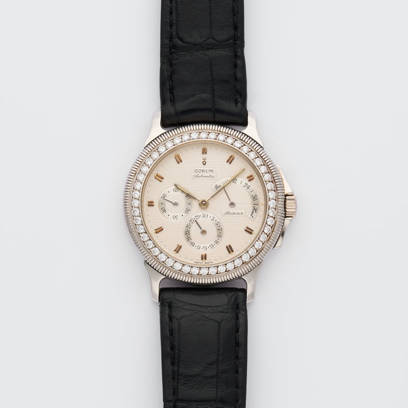 1990s Corum Platinum Réserve de marche Calendar Diamond-Set Bezel Silvered Guilloché Dial 73.109.79