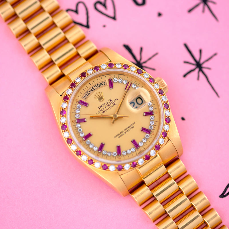 1983 Rolex Oyster Perpetual Day-Date 18k Yellow Gold Ruby "Baguette" string dial 18148