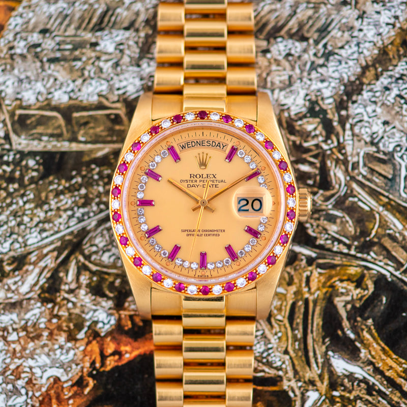 1983 Rolex Oyster Perpetual Day-Date 18k Yellow Gold Ruby "Baguette" string dial 18148