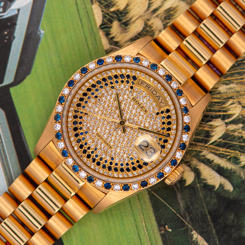 1986 Rolex Oyster Perpetual Day-Date 18k Yellow Gold Pavé diamonds and sapphire strings dial 18148