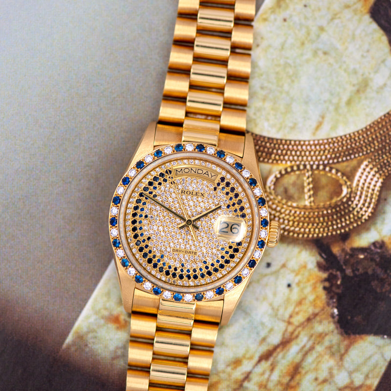1986 Rolex Oyster Perpetual Day-Date 18k Yellow Gold Pavé diamonds and sapphire strings dial 18148