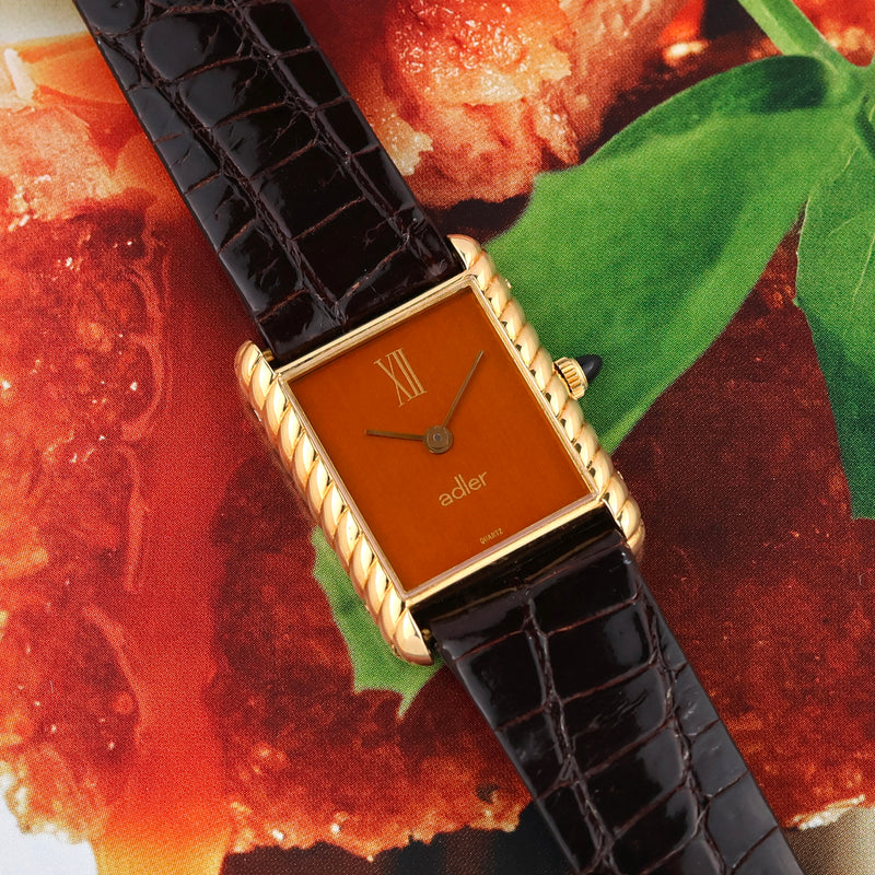 1980s Adler 18k Yellow Gold Tank "Torsadée" metallic Mandarine dial