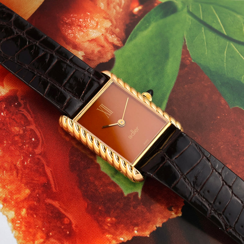 1980s Adler 18k Yellow Gold Tank "Torsadée" metallic Mandarine dial